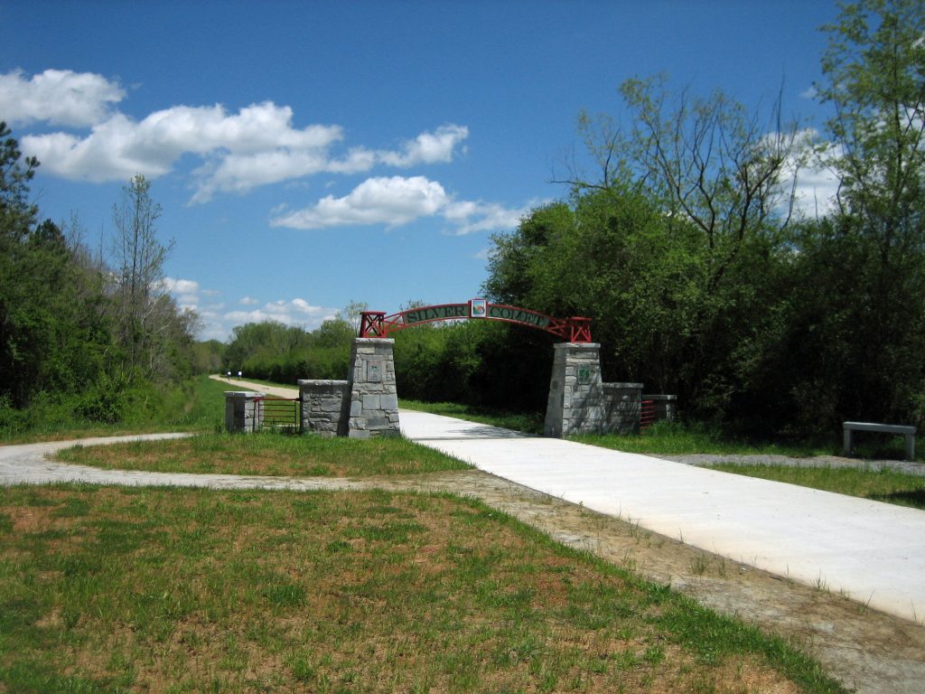 Entrance to the Silver Comet Trail through a bricked and metal archway with red detailing. Entrance to the Silver Comet Trail through a bricked and metal archway with red detailing.