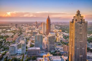 Aerial view featuring skyscrapers at Atlanta City, Georgia during sunset.