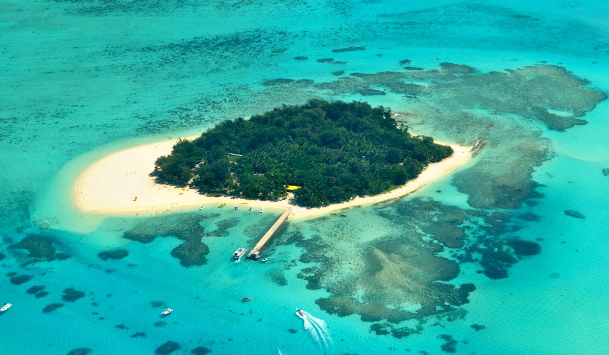 Aerial view of Managaha Island and its surrounding waters, an island of Northern Mariana Islands, one of the best places to travel without a passport.