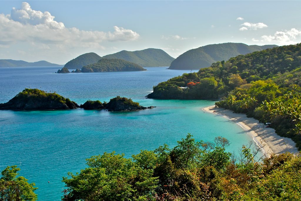 Green mountains and crystal clear waters along Trunk Bay in St. John, part of the US Virgin Islands.