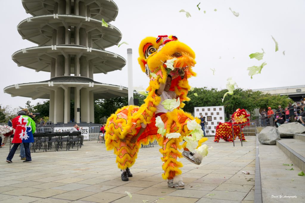 Chinese lion dance performers dancing at Peace Plaza during the Nihonmachi Street Fair.