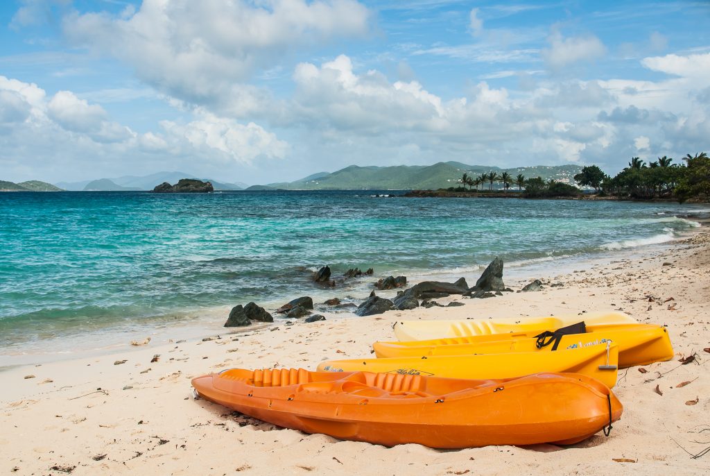 Orange kayaks on the shores of Sapphire Beach in St. Thomas.