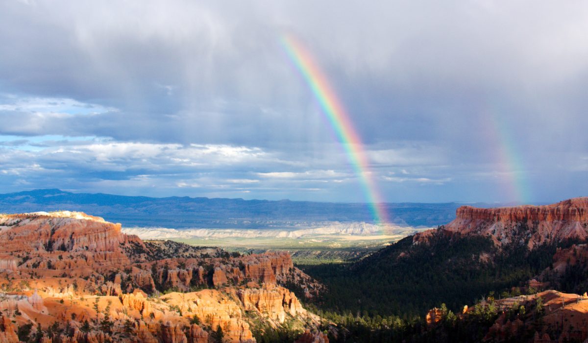 Rainbow over Bryce Canyon, one of best places to visit in May in the USA.