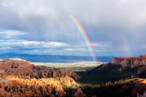 Rainbow over Bryce Canyon, one of best places to visit in May in the USA.