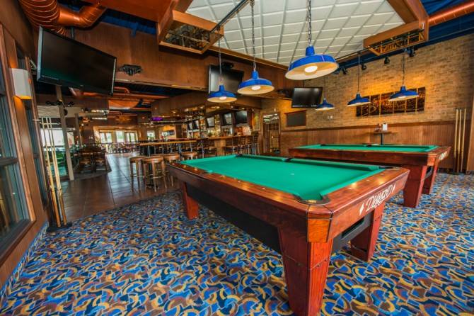 Interior of Bullfrog Bar featuring two billiard tables. Interior of Bullfrog Bar featuring two billiard tables.