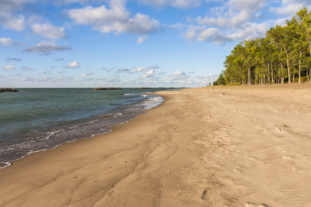 Alt Text: Calm waters of Presque Isle State Park Beach in Erie, PA. Alt Text: Calm waters of Presque Isle State Park Beach in Erie, PA.