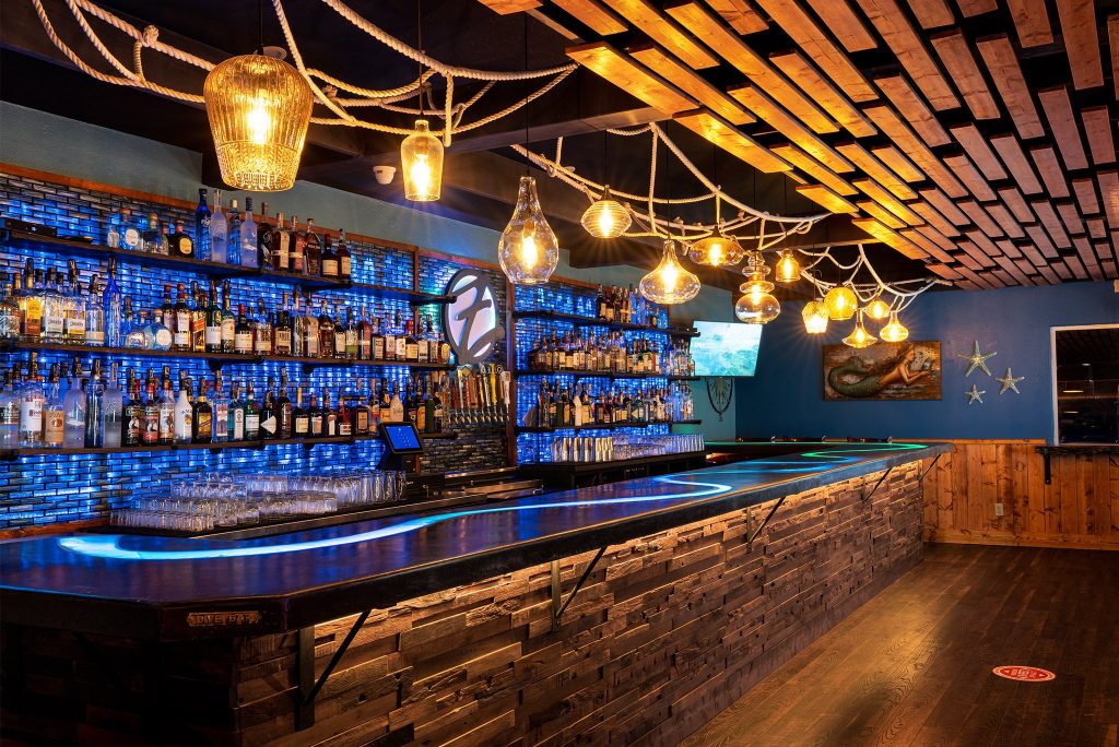 Vast selection of drinks hung on the wall of Zola’s on the Water in Brookings, Or.