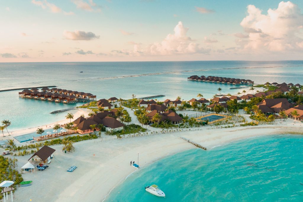 Aerial shot of the beachside resorts in Maldives, during the dry season, the best time to visit Maldives.