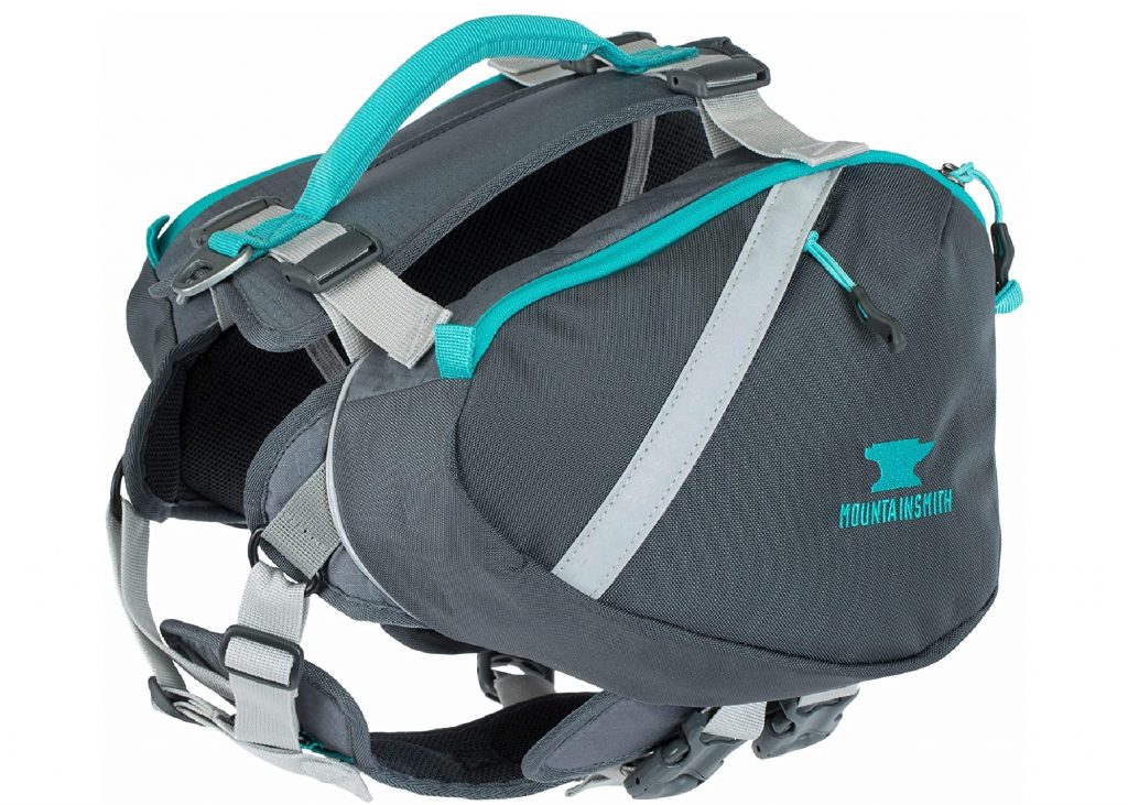 Mountainsmith K-9 Dog Pack in gray with blue-green detailing.
