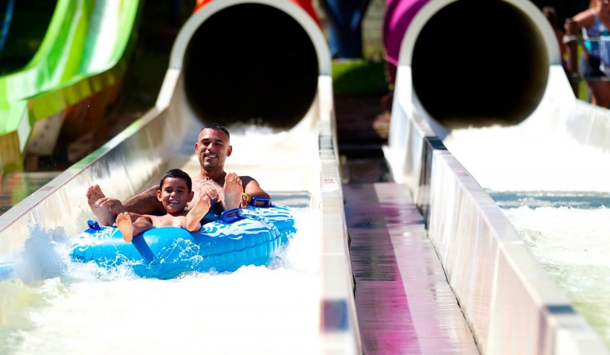 mountain creek waterpark guide Grown man and young boy sliding down the Vortex slide at Mountain Creek Waterpark.