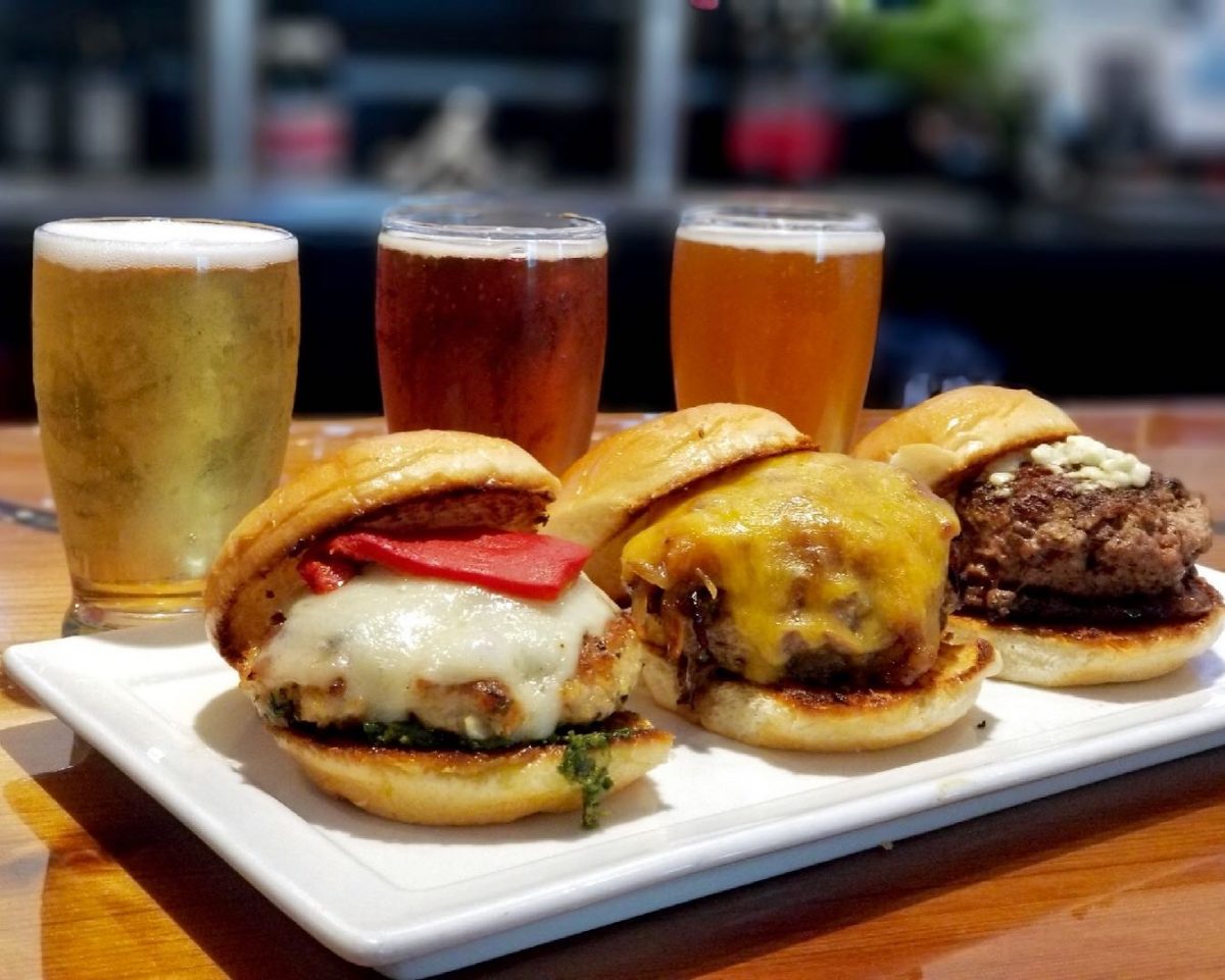 Plate of burger sliders and three glasses of beer from the Highliner Seward restaurant.