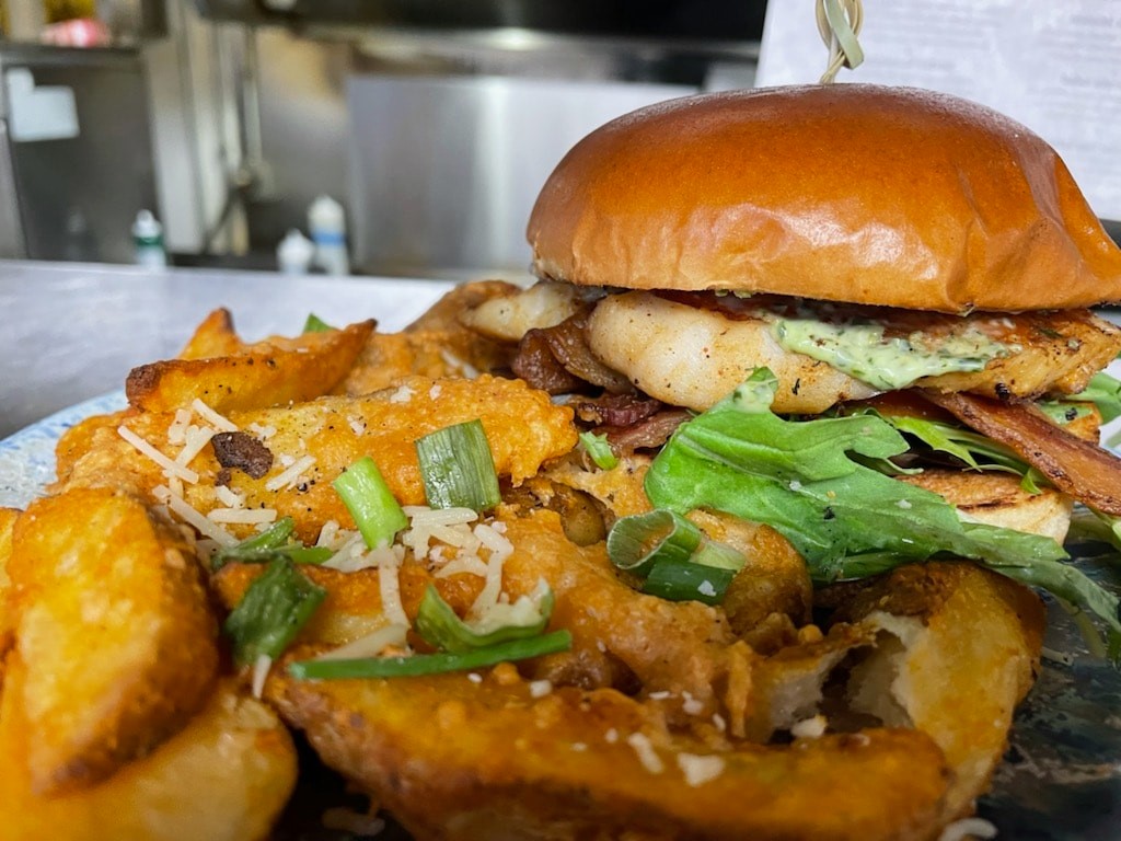 Close-up shot of burger and fries from Mermaid Grotto Cafe, one of the unique Seward restaurants.