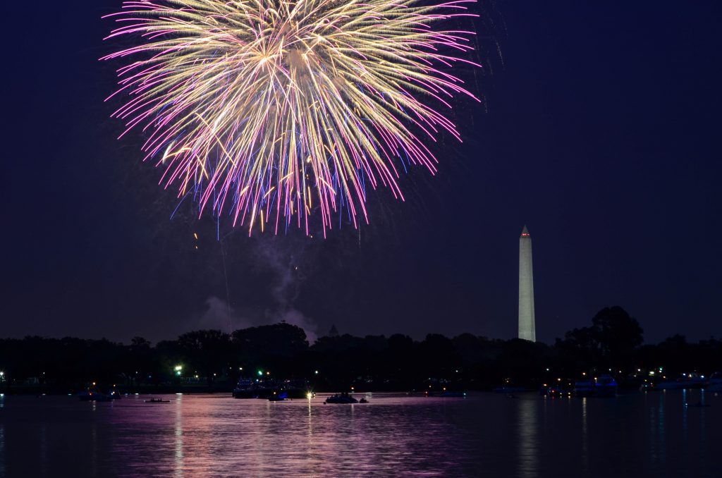 Fourth of July fireworks on the National Park tidal basin, with the Washington Monument in Washington, DC.
