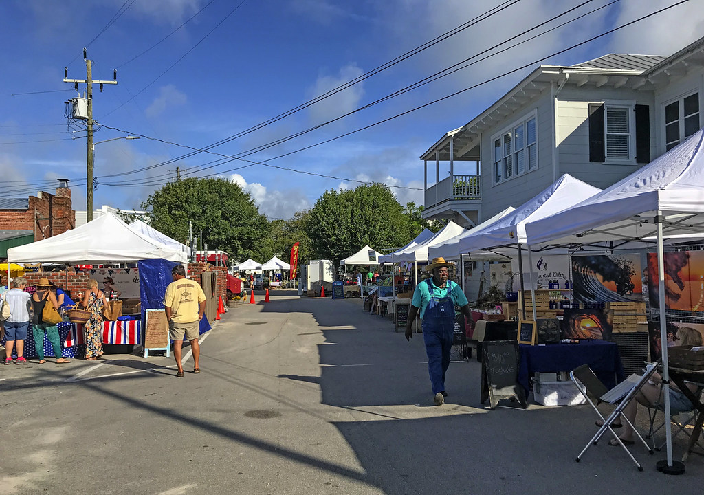Area lined with tents while people walk around during a local farmers market at Beaufort, South Carolina.