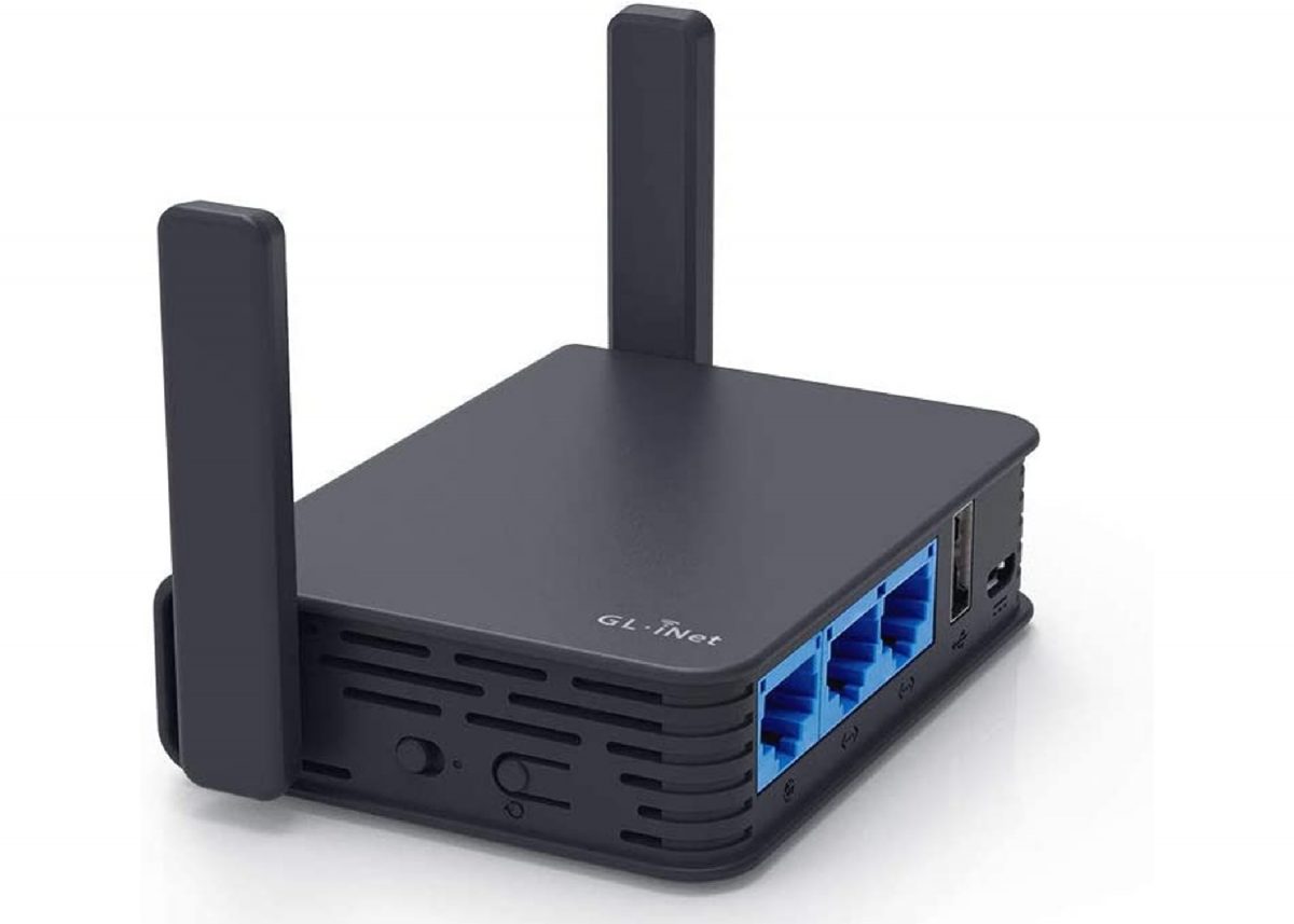 GL.iNet GL-AR750S-Ext travel router in black with blue detailing along the cable ports.
