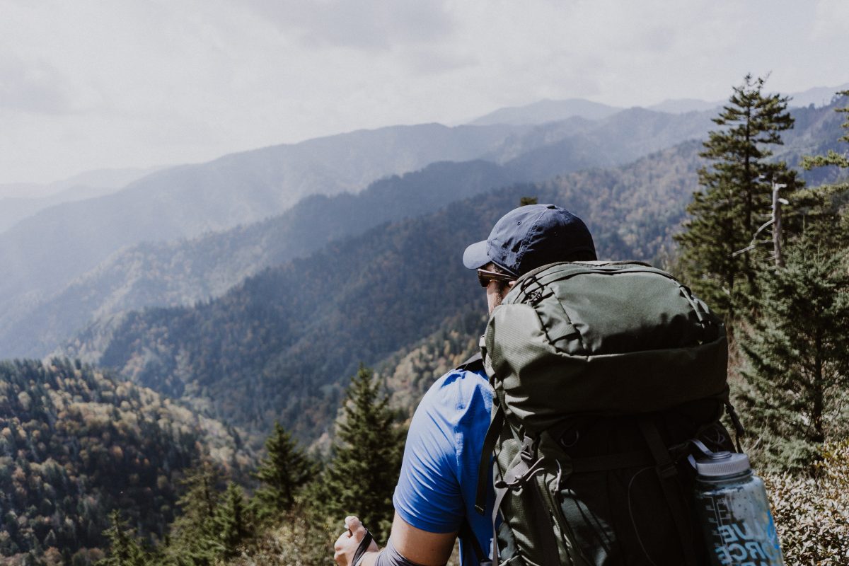 Man standing on top of a mountain within the Great Smoky Mountains National Park during September. 