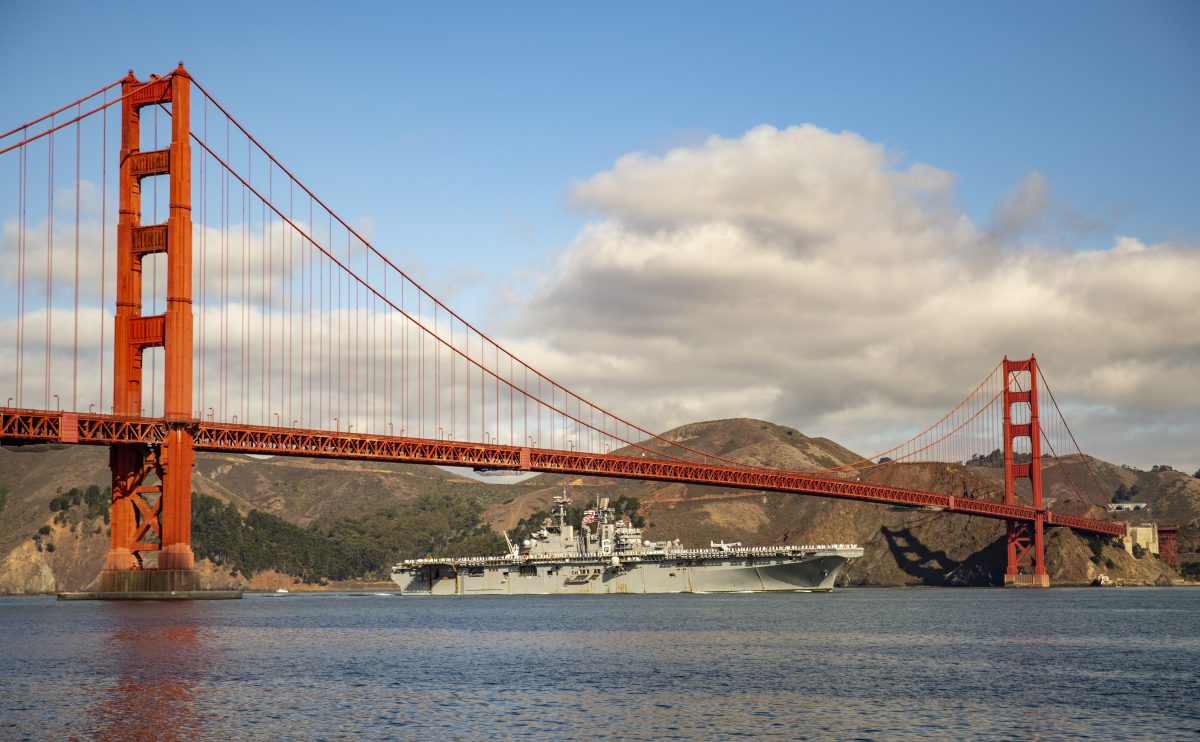 Naval ship sailing under the Golden Gate Bridge in San Francisco during Fleet Week in October. 