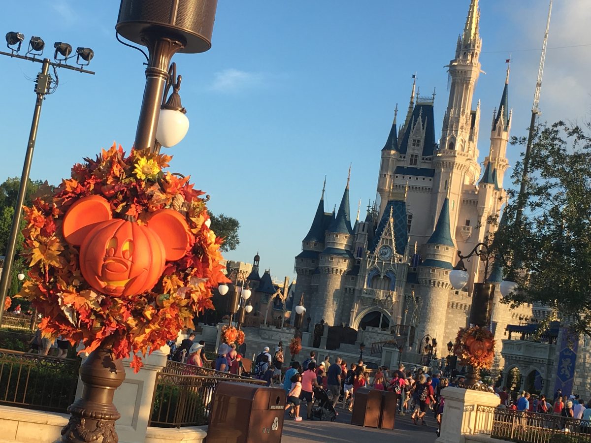 Pumpkin carving shaped in the likeness of Mickey Mouse in Walt Disney World, with the Cinderella Castle in the background.