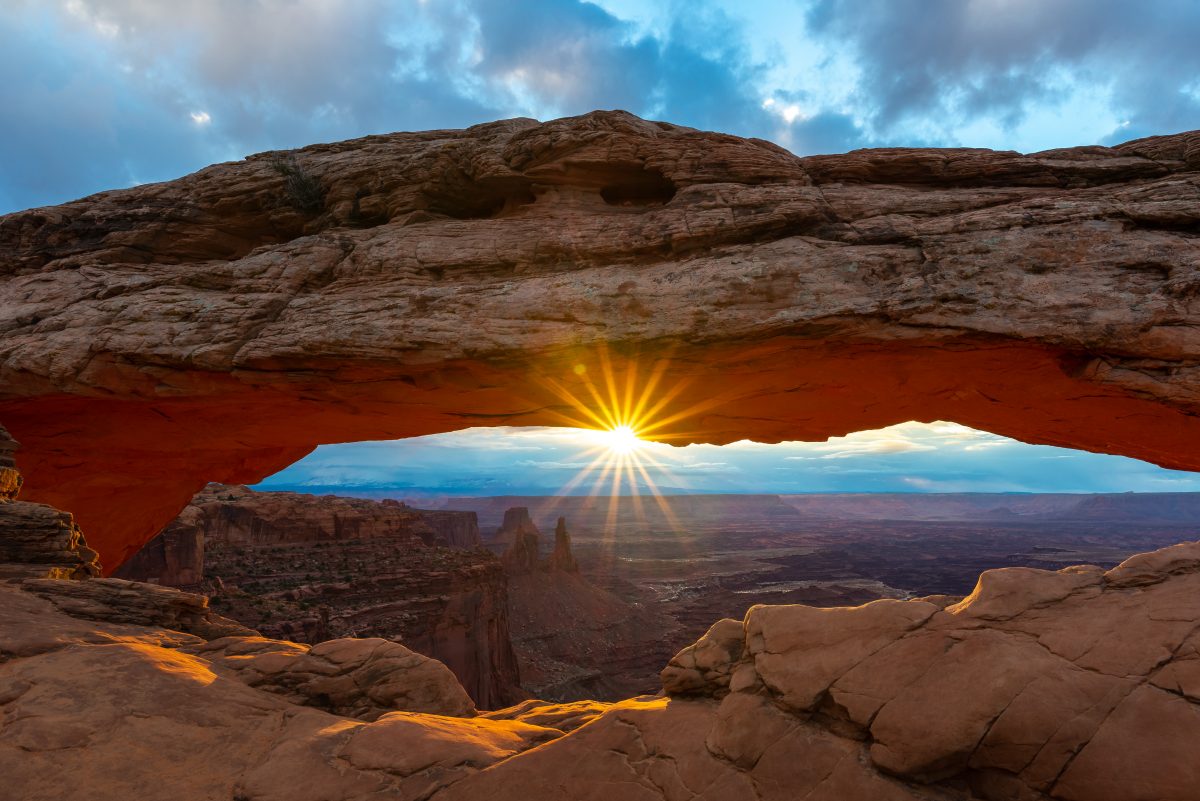 sunset over the rock formations at canyonlands national park.