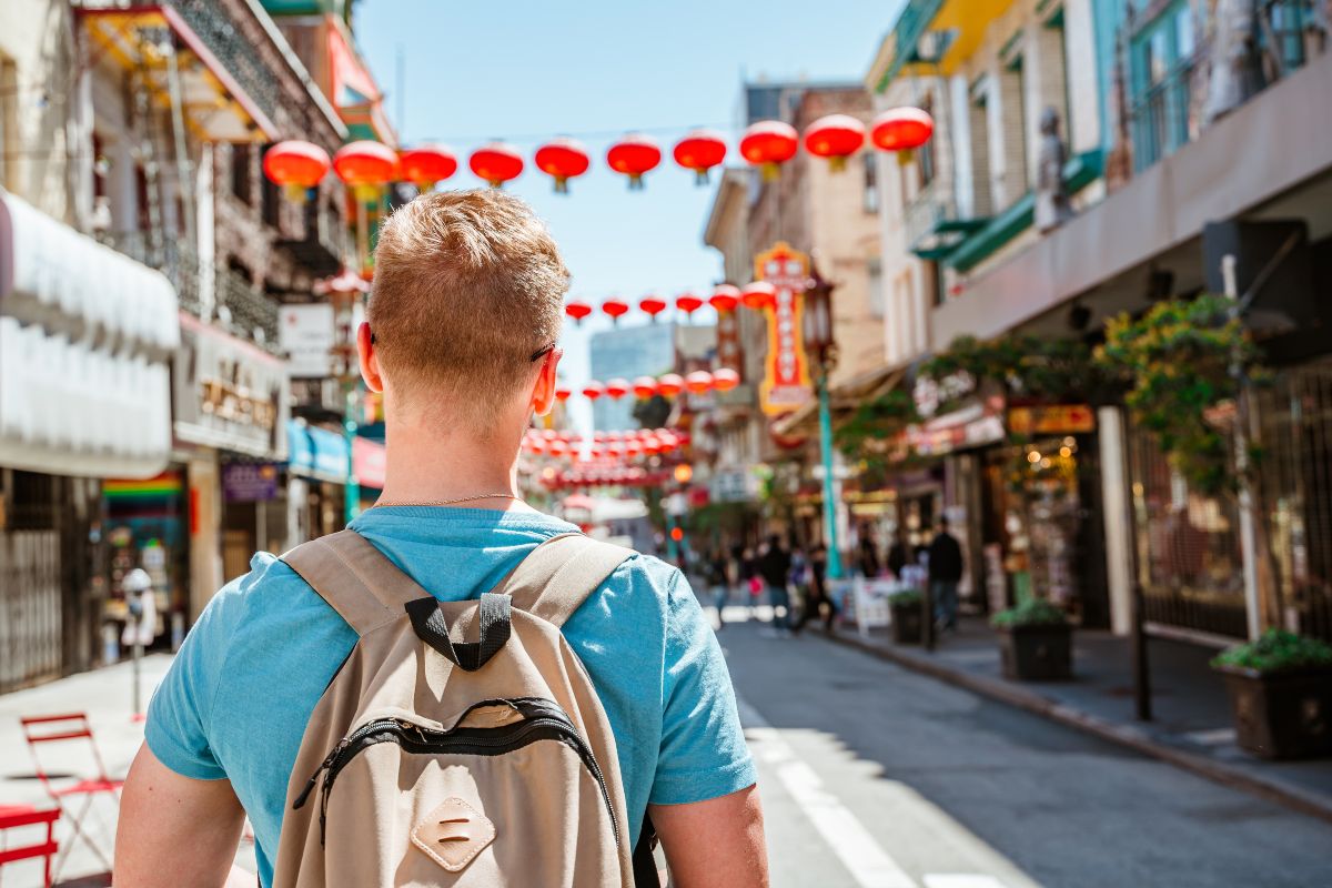 Man walking in Chinatown, San Francisco, the most walkable city in the US