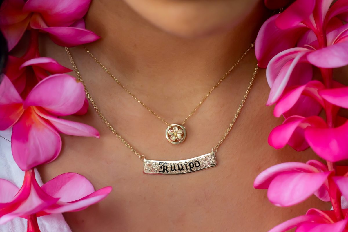 close-up shot of gold hawaii-inspired pendants, one of the top hawaiian jewelry to gift someone. 