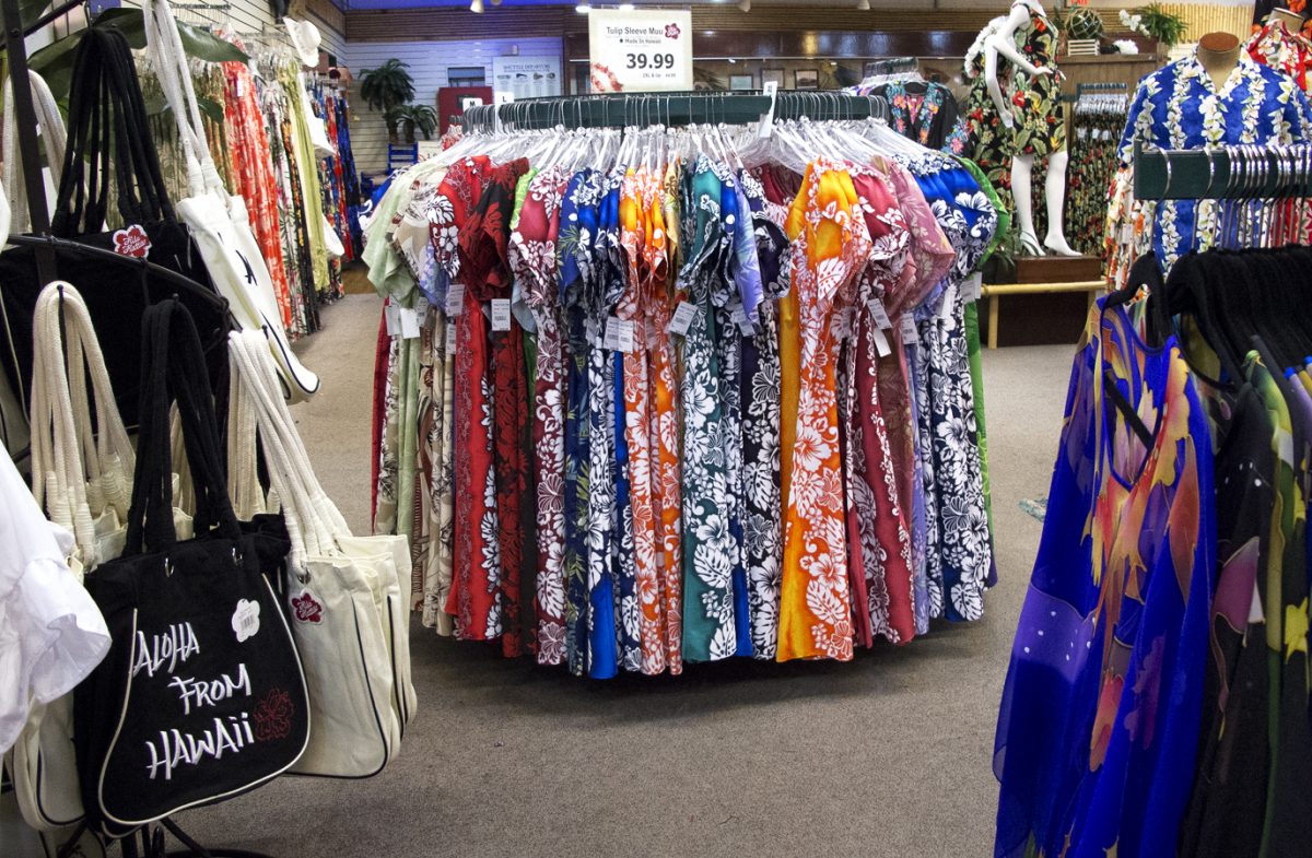 aloha shirts and other clothing items and accessories on display at hilo hattie.