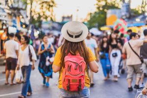 Female tourist exploring a busy city street