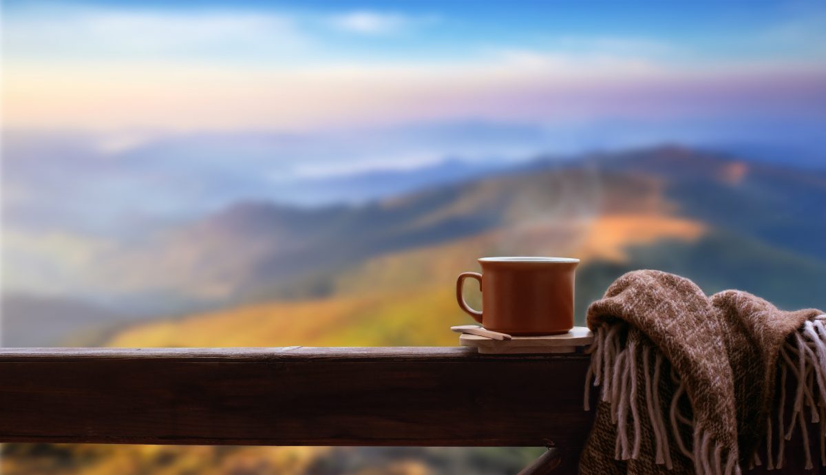 cup of coffee in front of mountains cup of coffee in front of mountains