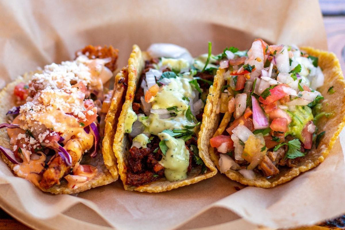 three different street tacos from salud tacos, san diego.