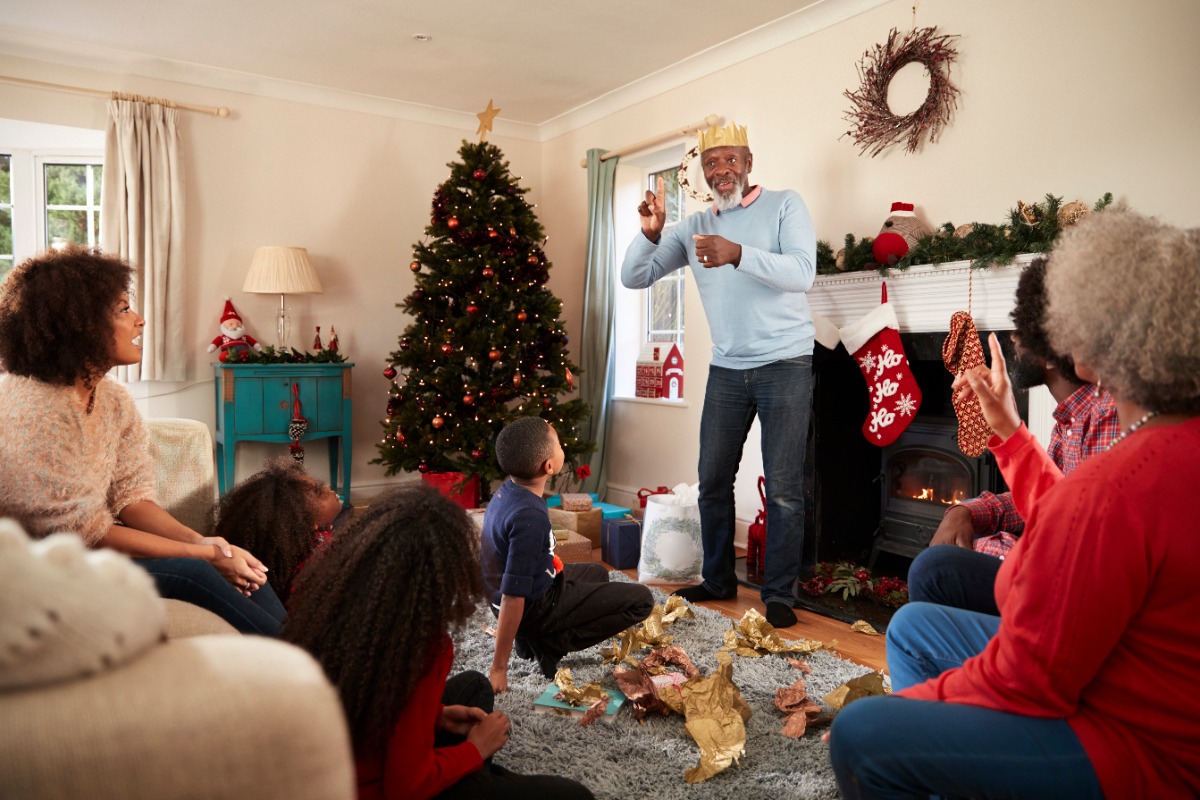 family playing charades family playing charades