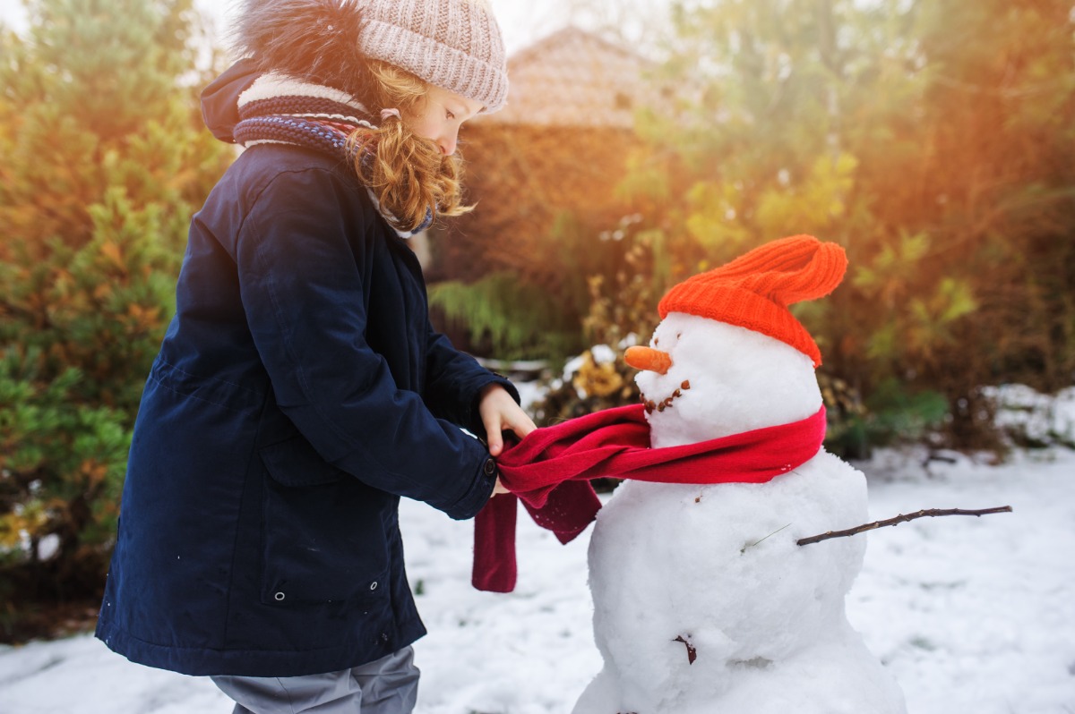 happy girl making snow man happy girl making snow man