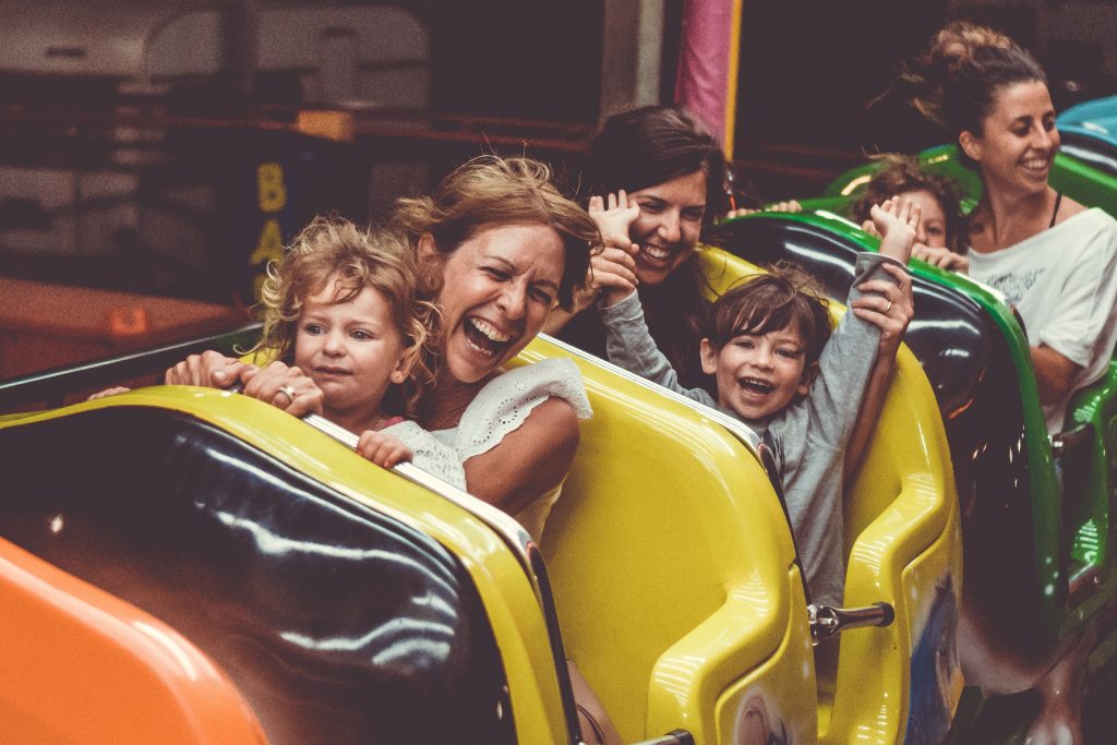mother and child smiling brightly while on a amusement ride mother and child smiling brightly while on a amusement ride