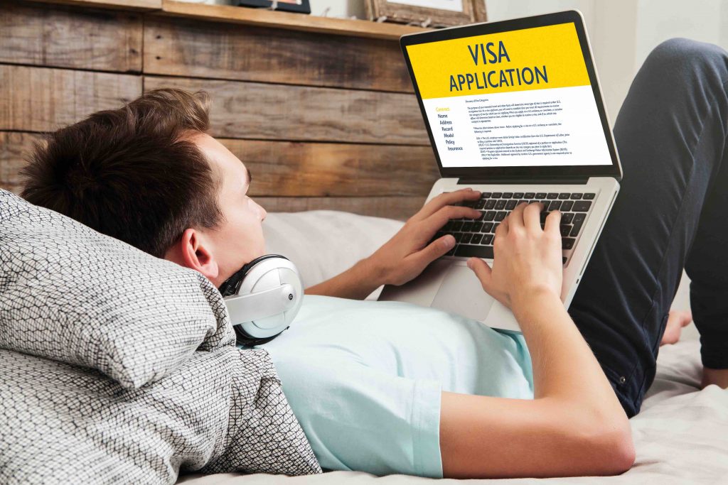 Man doing electronic Visa Application in a laptop by internet at home. Man doing electronic Visa Application in a laptop by internet at home.