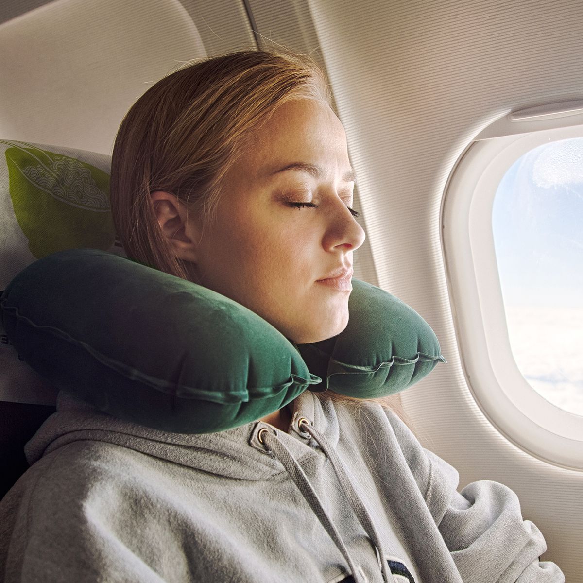 Adjustable neck pillow hangs over your seat for FIRM head, neck