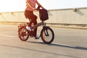 young woman riding an electric bicycle