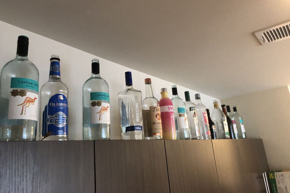 Empty-Alcohol-Bottles-In-A-Store-Room-On-The-Albanian-Island-Of-Sazan empty-alcohol-bottles-in-a-store-room-on-the-albanian-island-of-sazan