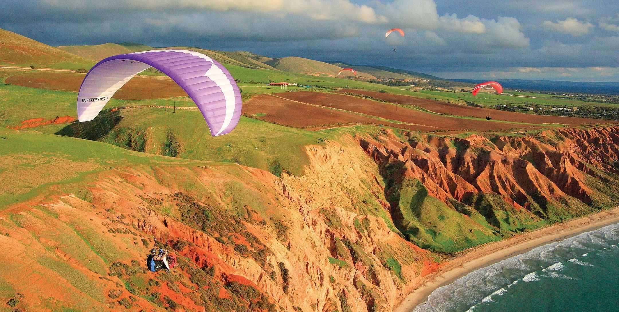 Exhilarating-Paragliding-Adventures-Over-Coastal-Cliffs exhilarating-paragliding-adventures-over-coastal-cliffs