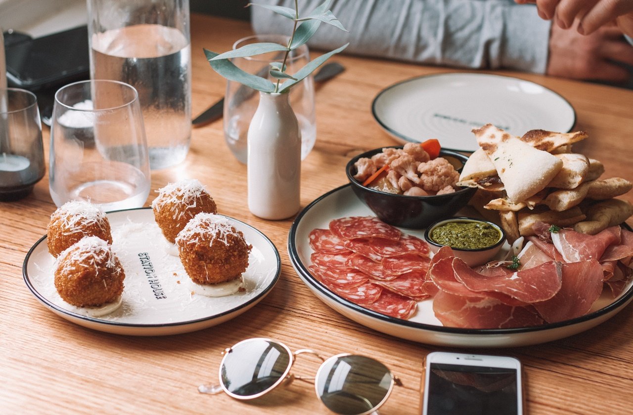 Table with plates of spanish tapas