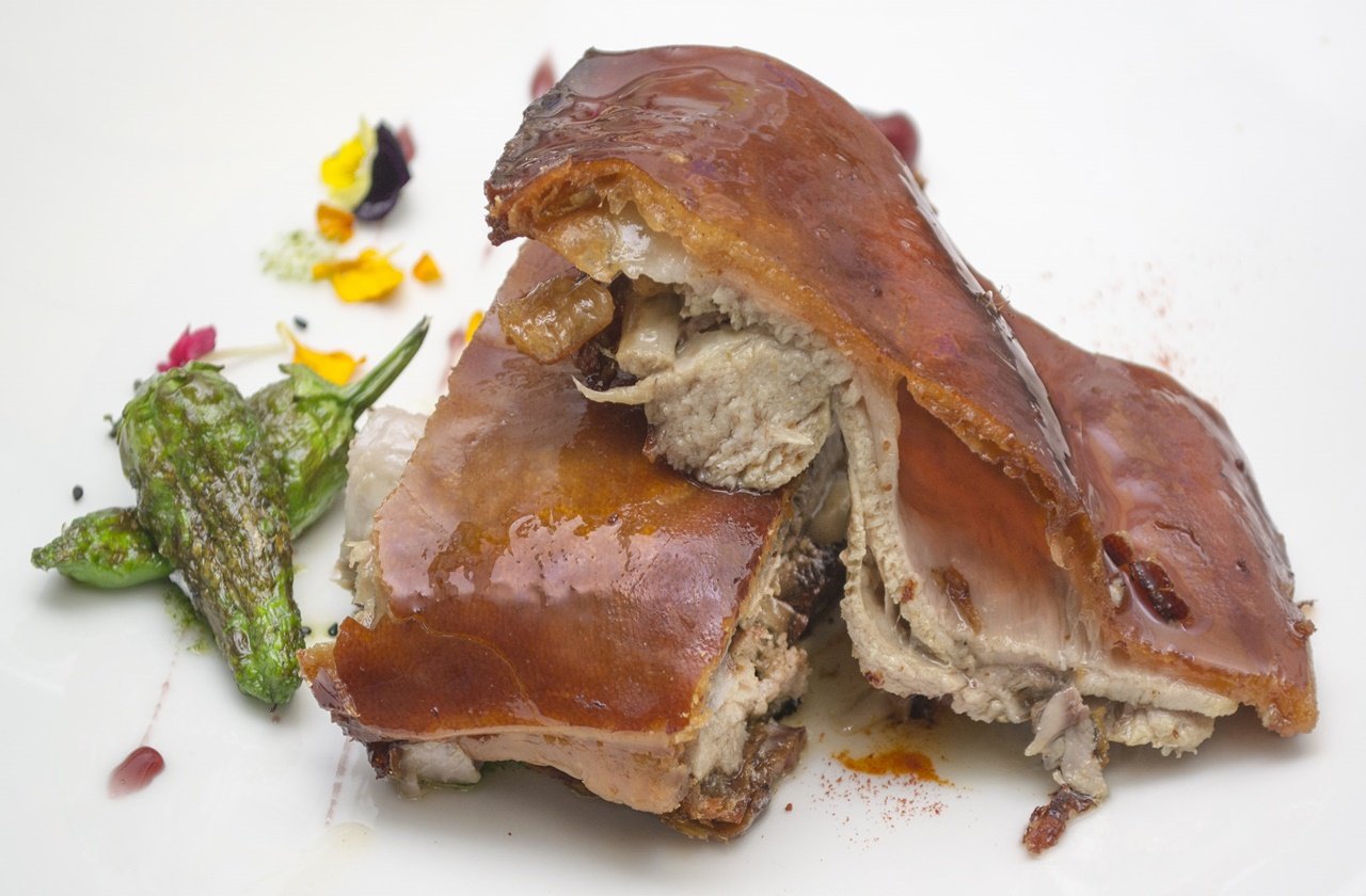 Lechon Chopped lechon served with a side salad