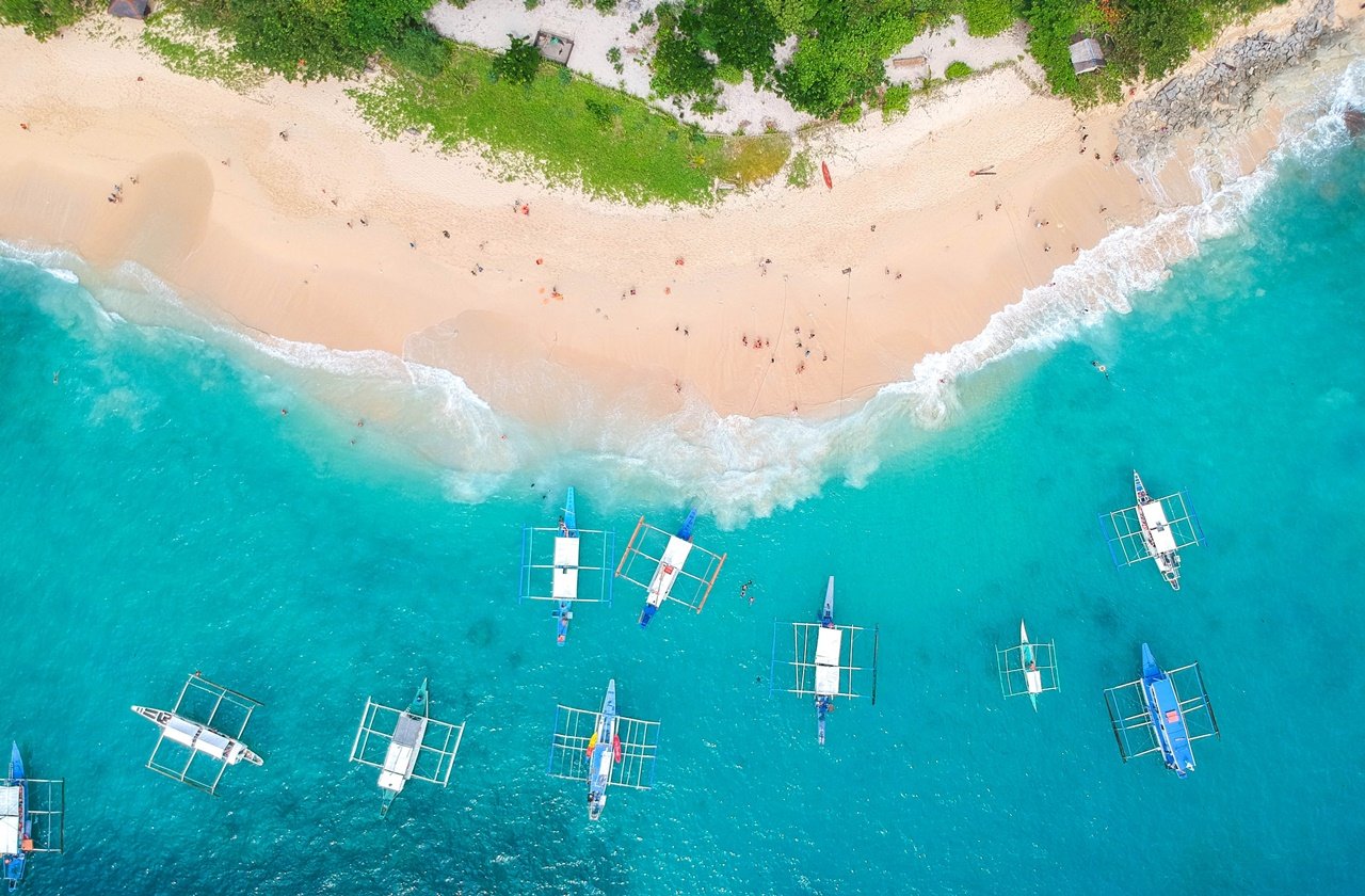 Philippines island hopping Aerial view of boats on an island in the philippines