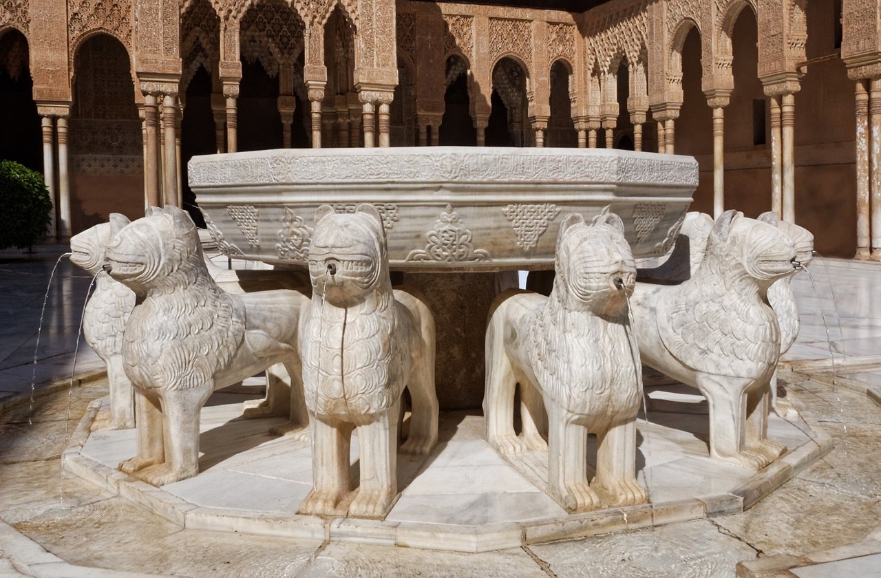 The iconic marble lions at the Palace of the Lions in Alhambra
