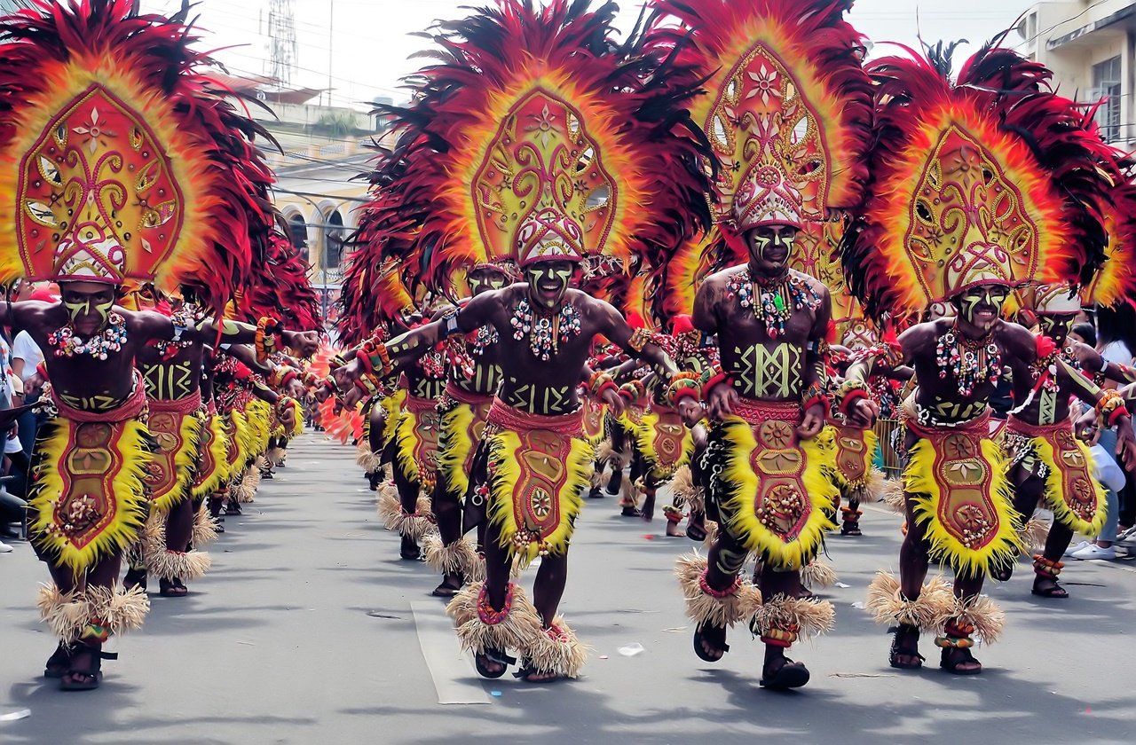 Dancers dressed in tribal attire on a Dinagyang street parade