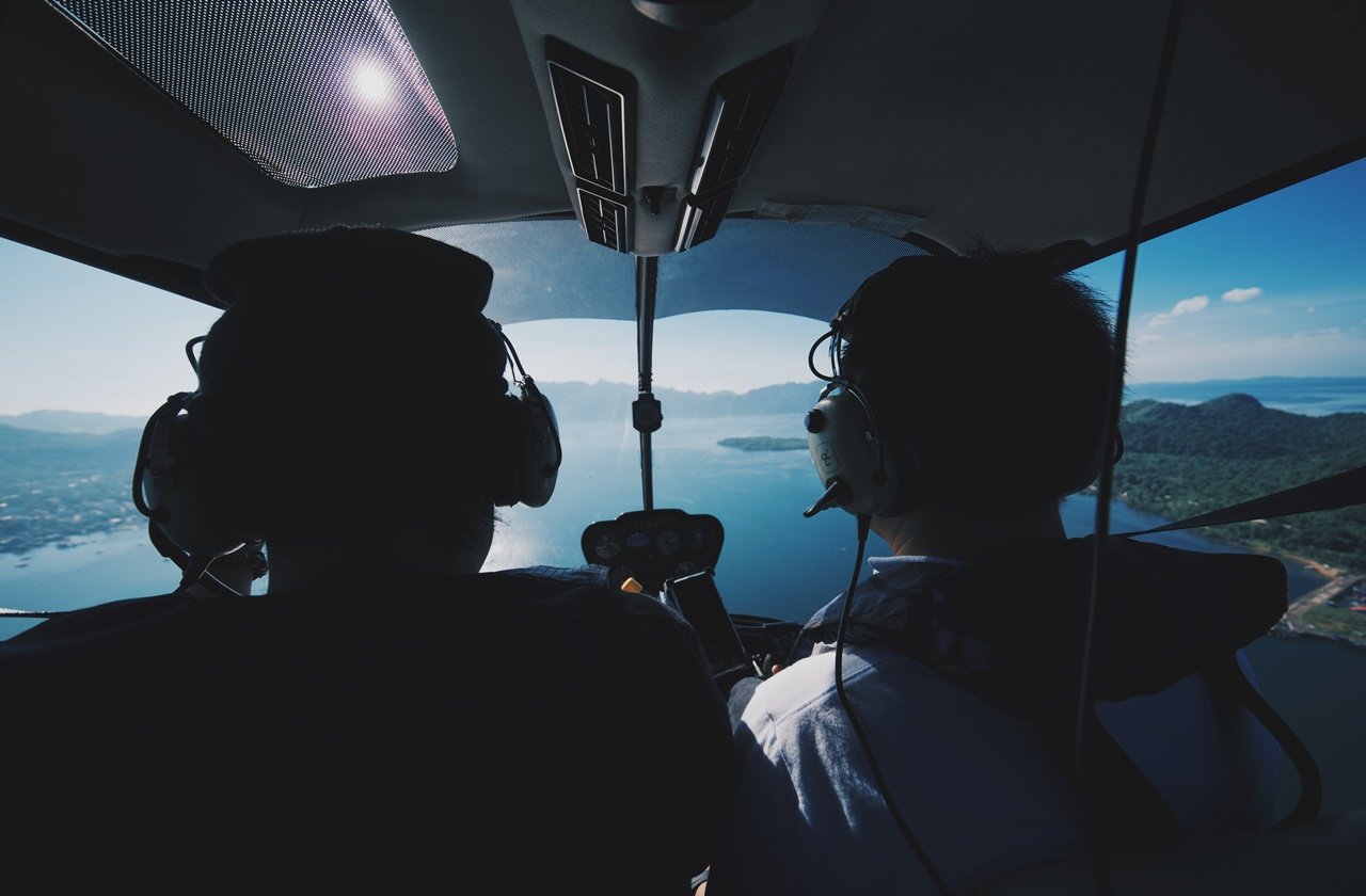 Two men on a helicopter tour