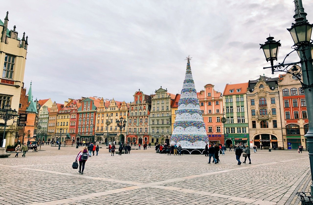 Wroclaw town center with pastel-colored buildings and Christmas tree