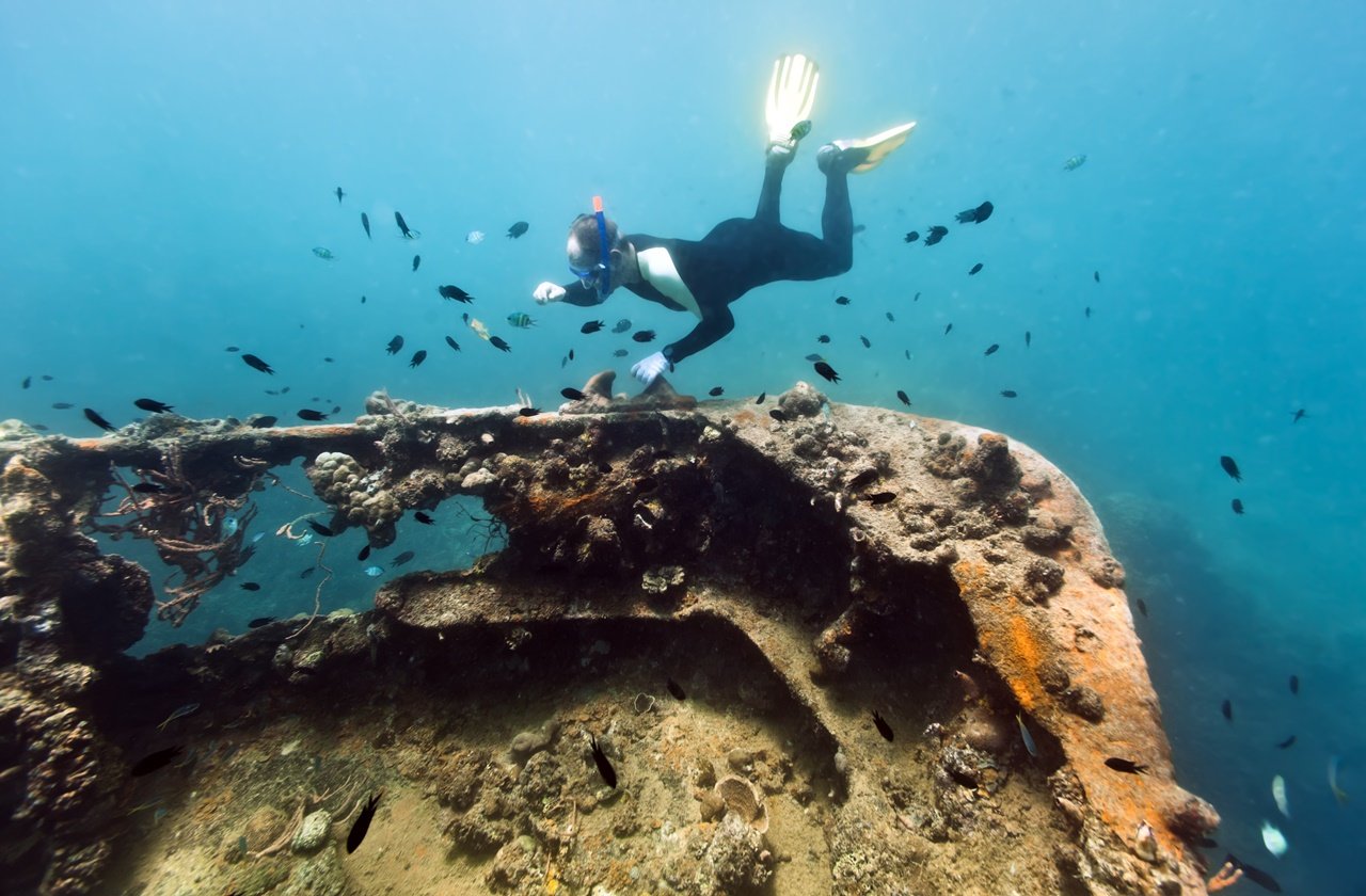 Freediver near a shipwreck