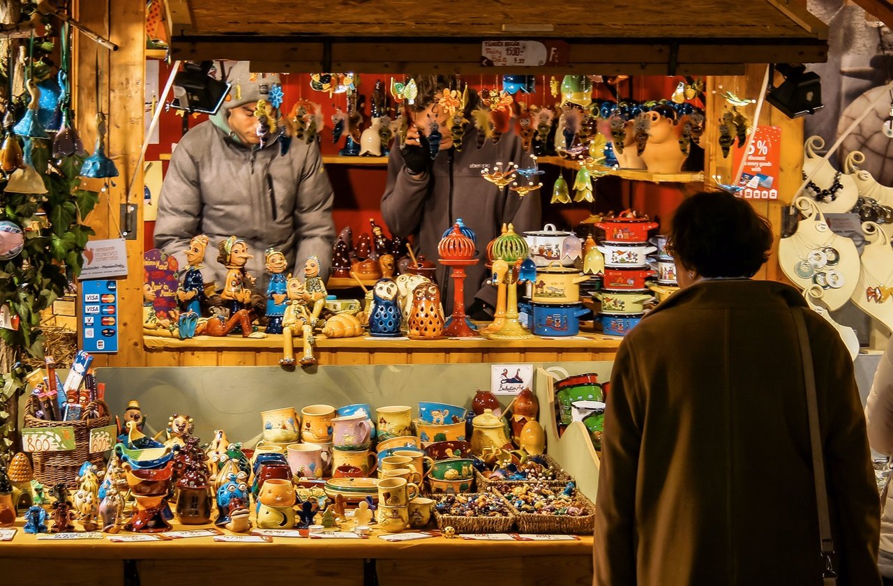 Customer checking out items sold at a Christmas market in Budapest