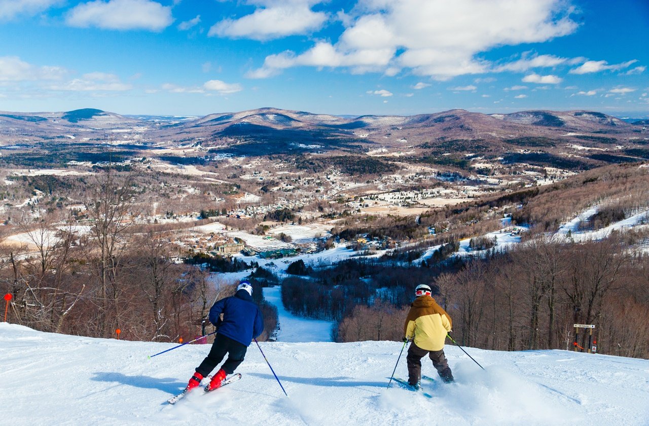 Two skiers going downhill in Windham, New York