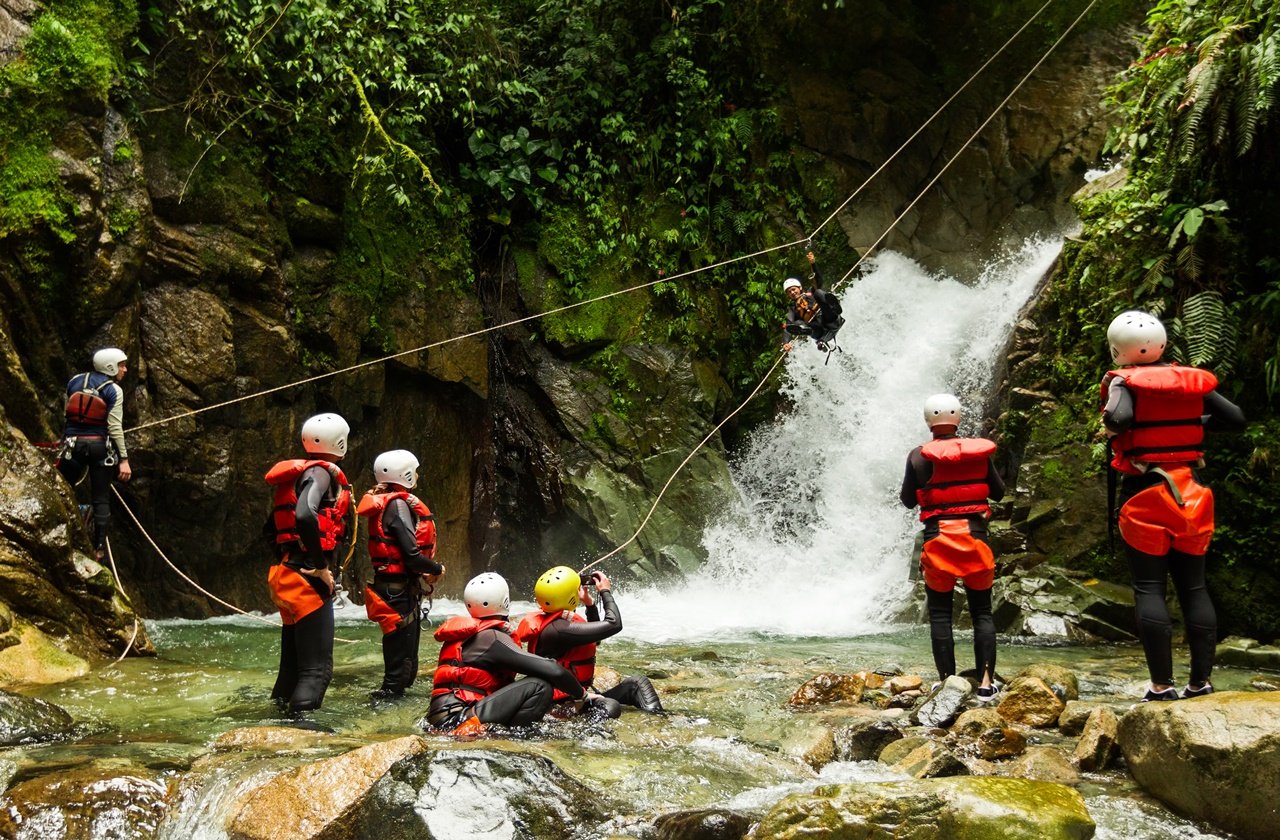 Canyoning ZIplining down a waterfall