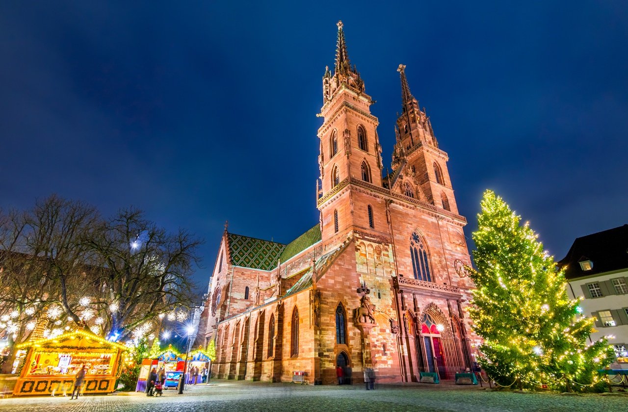 Basel Minster next to a giant Christmas tree