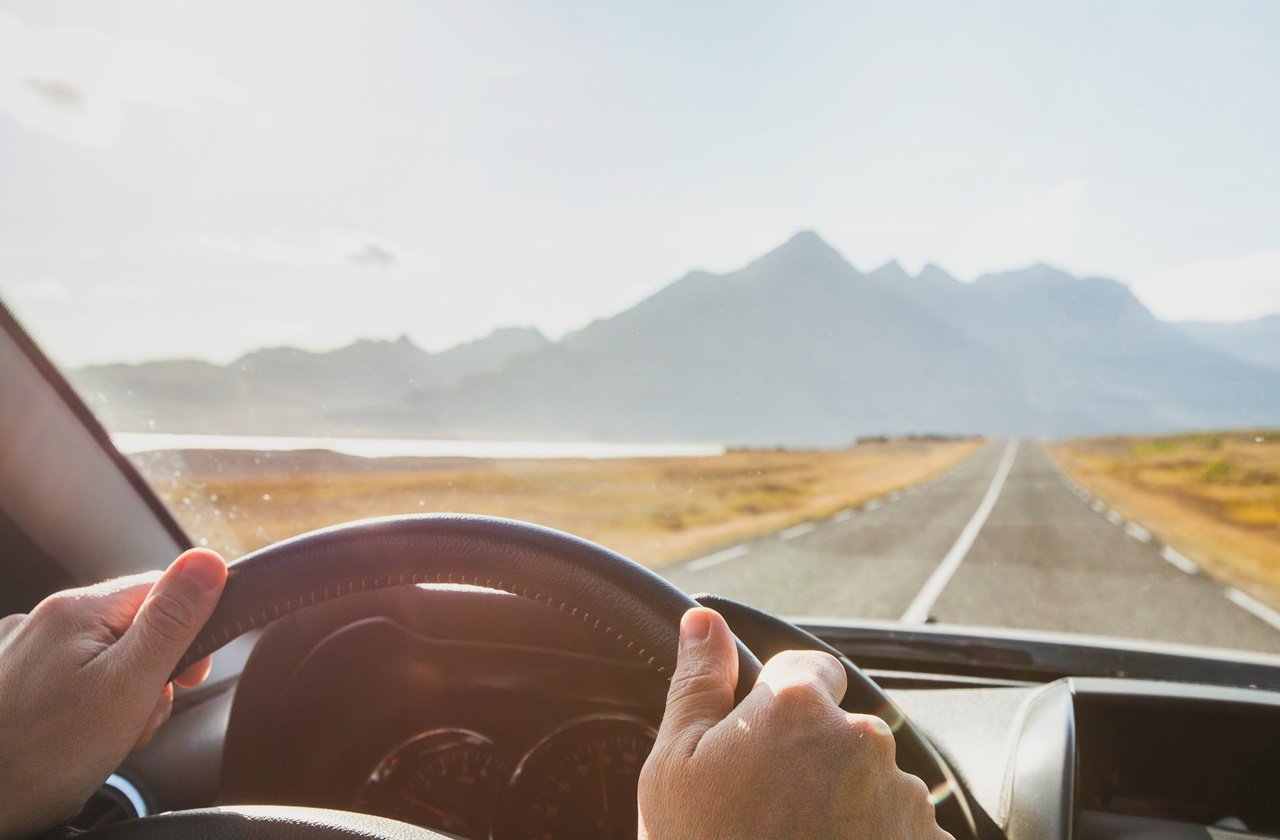 View of the driver's seat overlooking a mountain